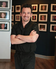 Dr. Brandon Turley smiling in his practice.